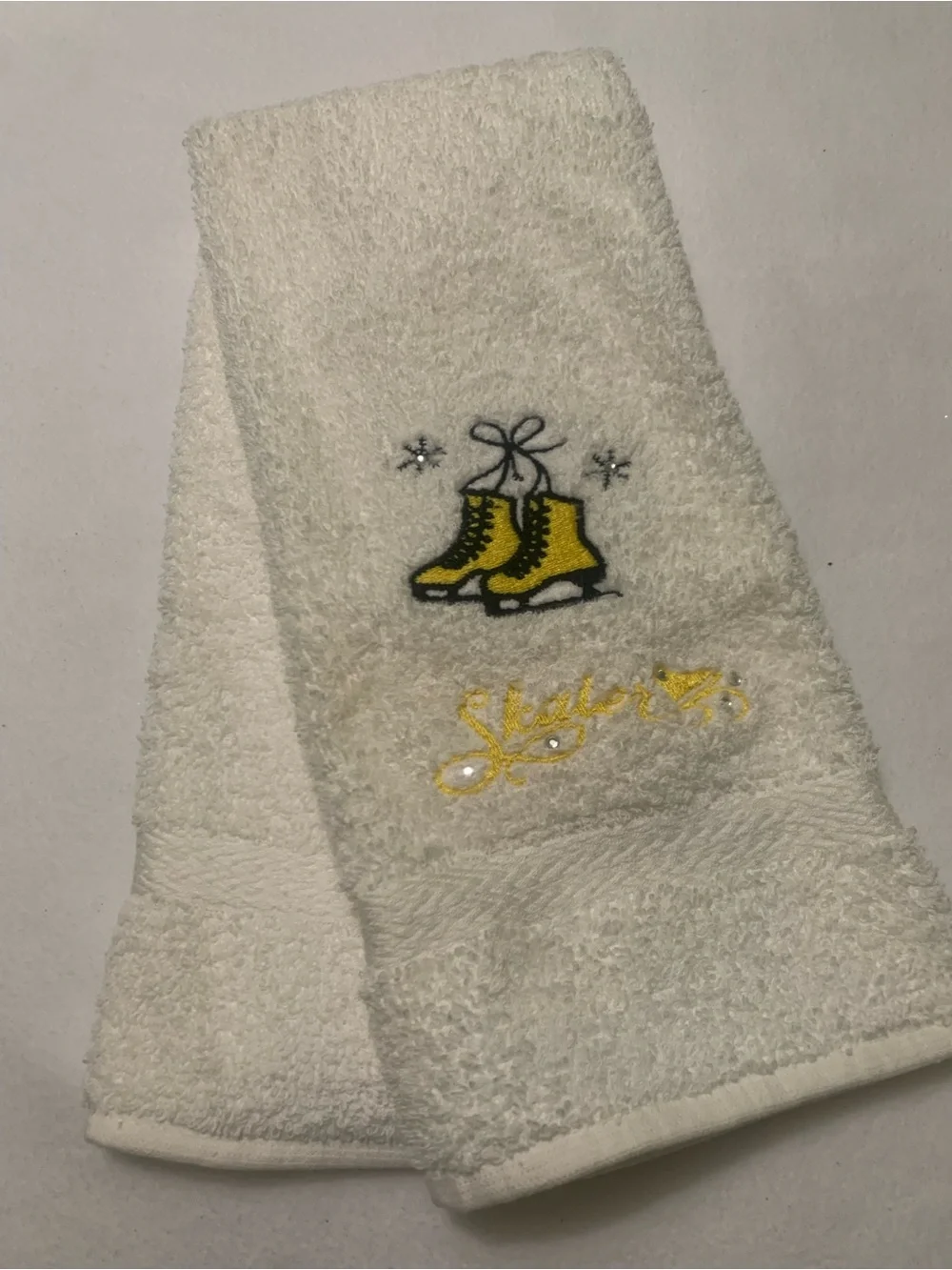 Mystique Boutique White Hand Towels With  Embroidered Ice Skates Yellow & Green